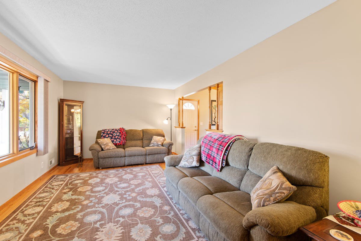 Plush sofas around a coffee table illustrating feng shui sofa placement details Inviting living room with plush sofas and a coffee table in a warm, balanced arrangement, illustrating feng shui details