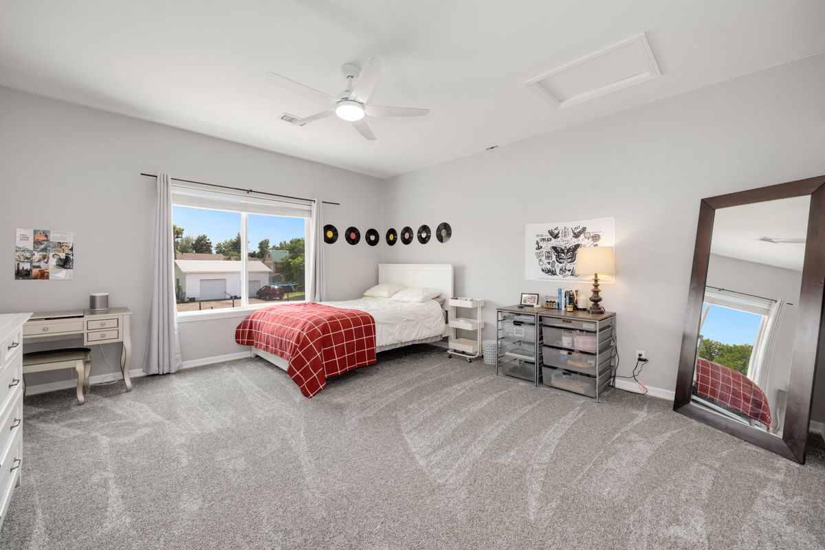 Spacious room with a large floor mirror and modern decor, illustrating an oversized leaning floor mirror