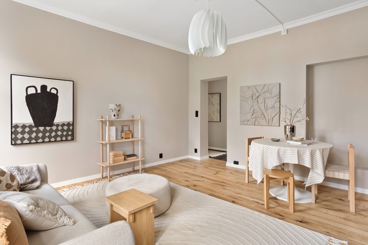 Elegant minimalist living room in neutral tones, illustrating how color shapes a feng shui living room