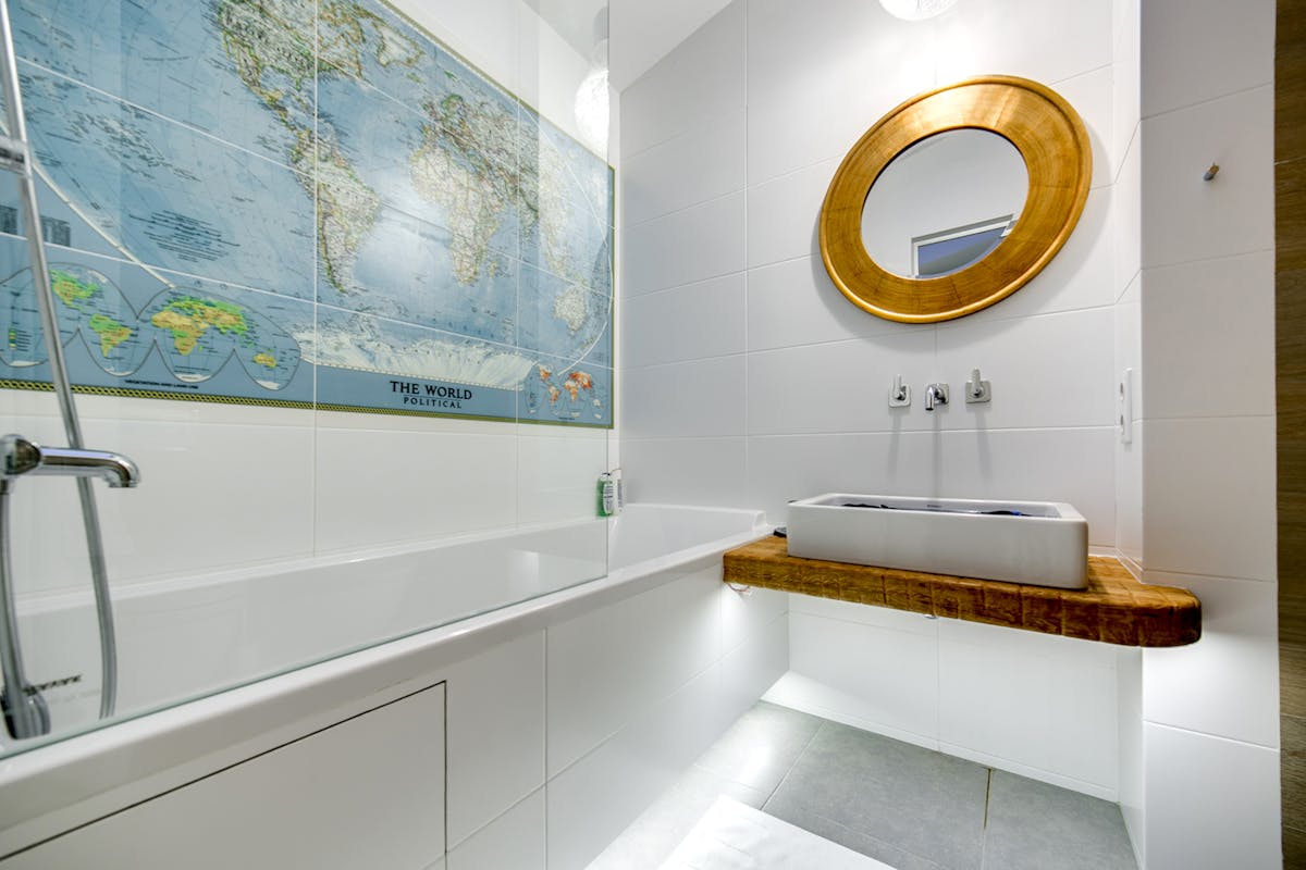 Elegant bathroom with double sink vanity and symmetrical mirrors