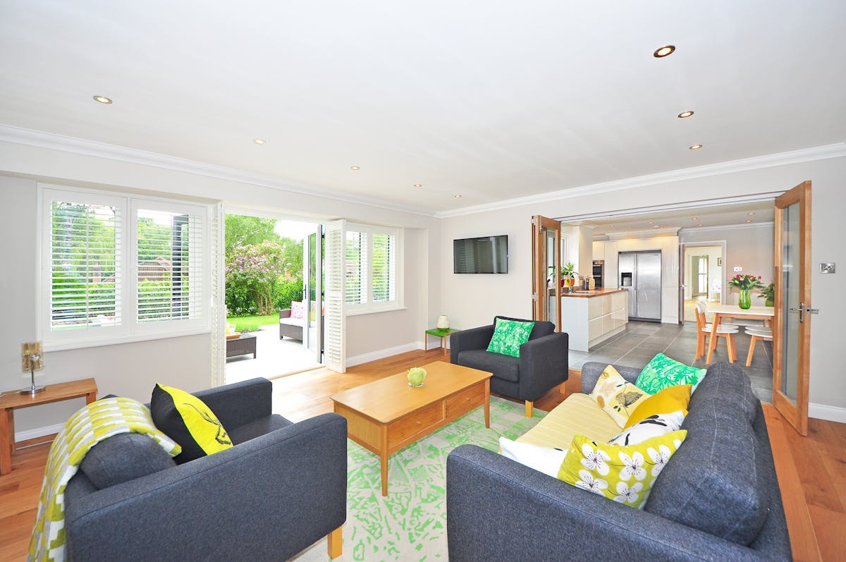 Bright, airy open-plan living room with clear sightlines and natural light, illustrating feng shui living room energy flow
