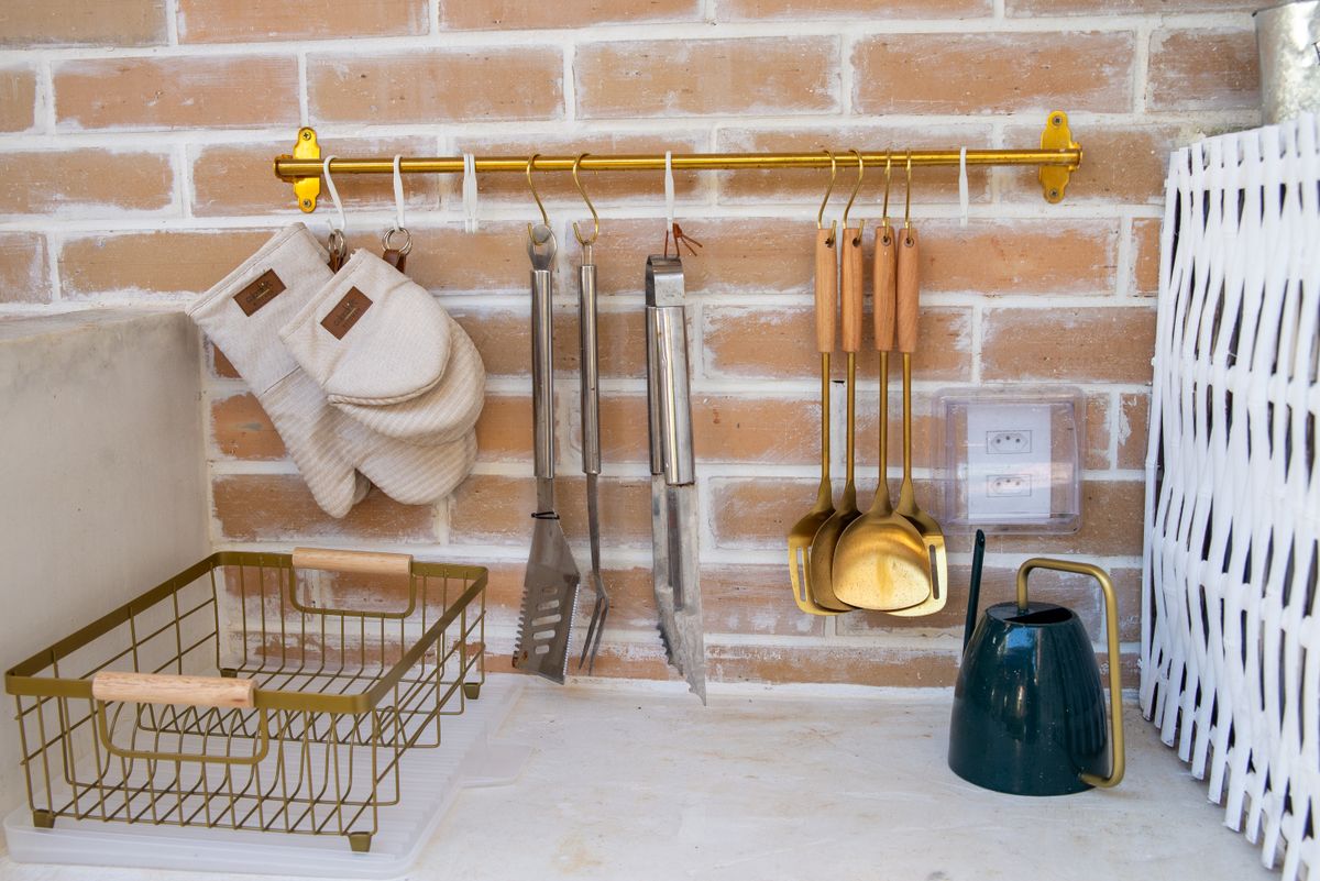 Kitchen wall with utensils and decor on a brick wall, illustrating kitchen signs and word art