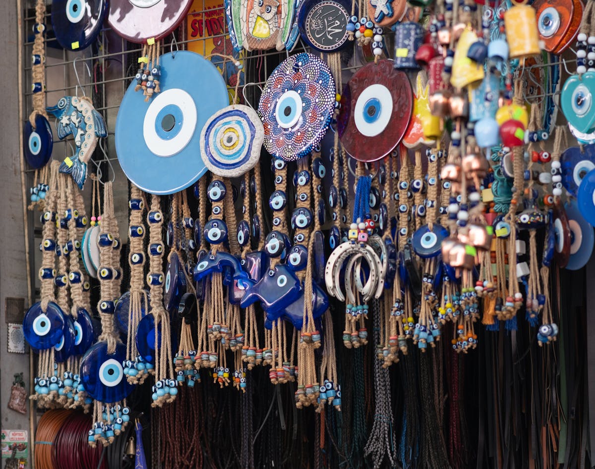 Vibrant display of traditional evil eye beads and trinkets at a market showing Mediterranean and West Asian craft heritage