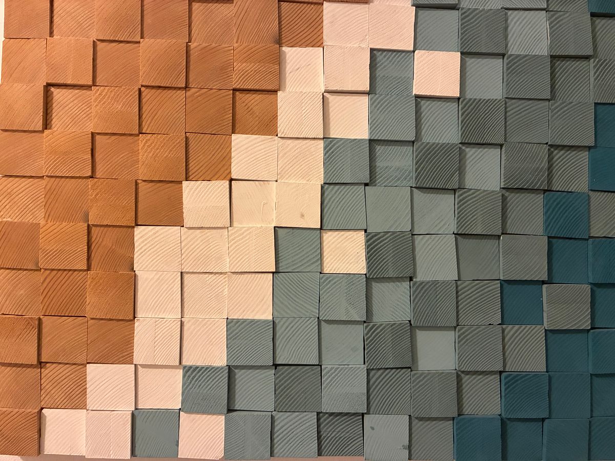 Geometric wooden block mosaic in earth tones, illustrating geometric and 3D wooden wall decorations