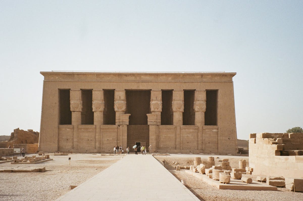 Front view of the Temple of Hathor in Dendera, Egypt, connecting ancient Egyptian mirrors with Hathor and sacred reflection.