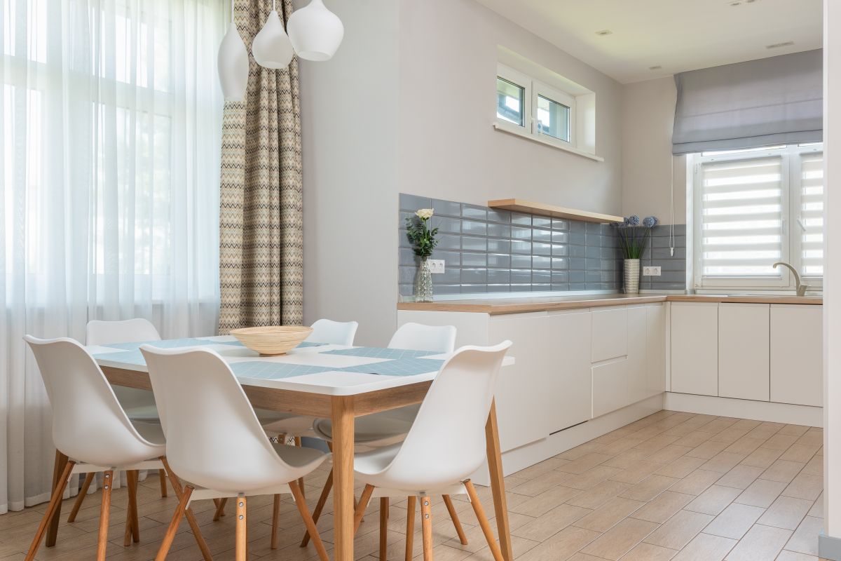 Contemporary minimalist kitchen in natural materials, illustrating caring for metal wall art in a kitchen