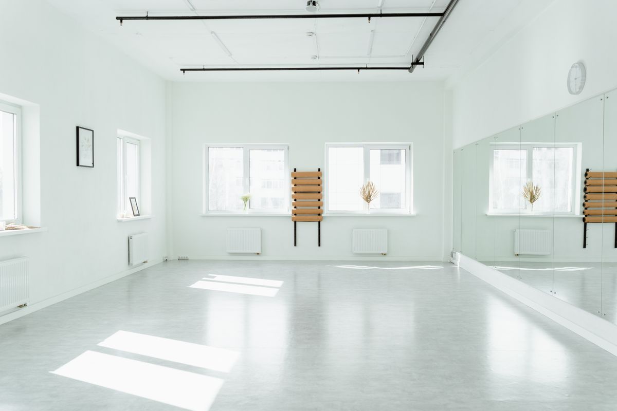 Minimalist modern round mirror on wall with bright natural window light