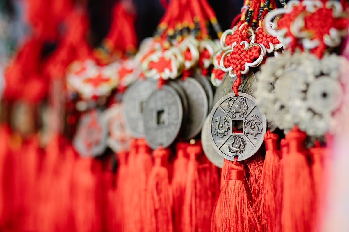 Assorted Feng Shui style coins ornaments symbolizing qi wealth cures associated with mirrored amplification