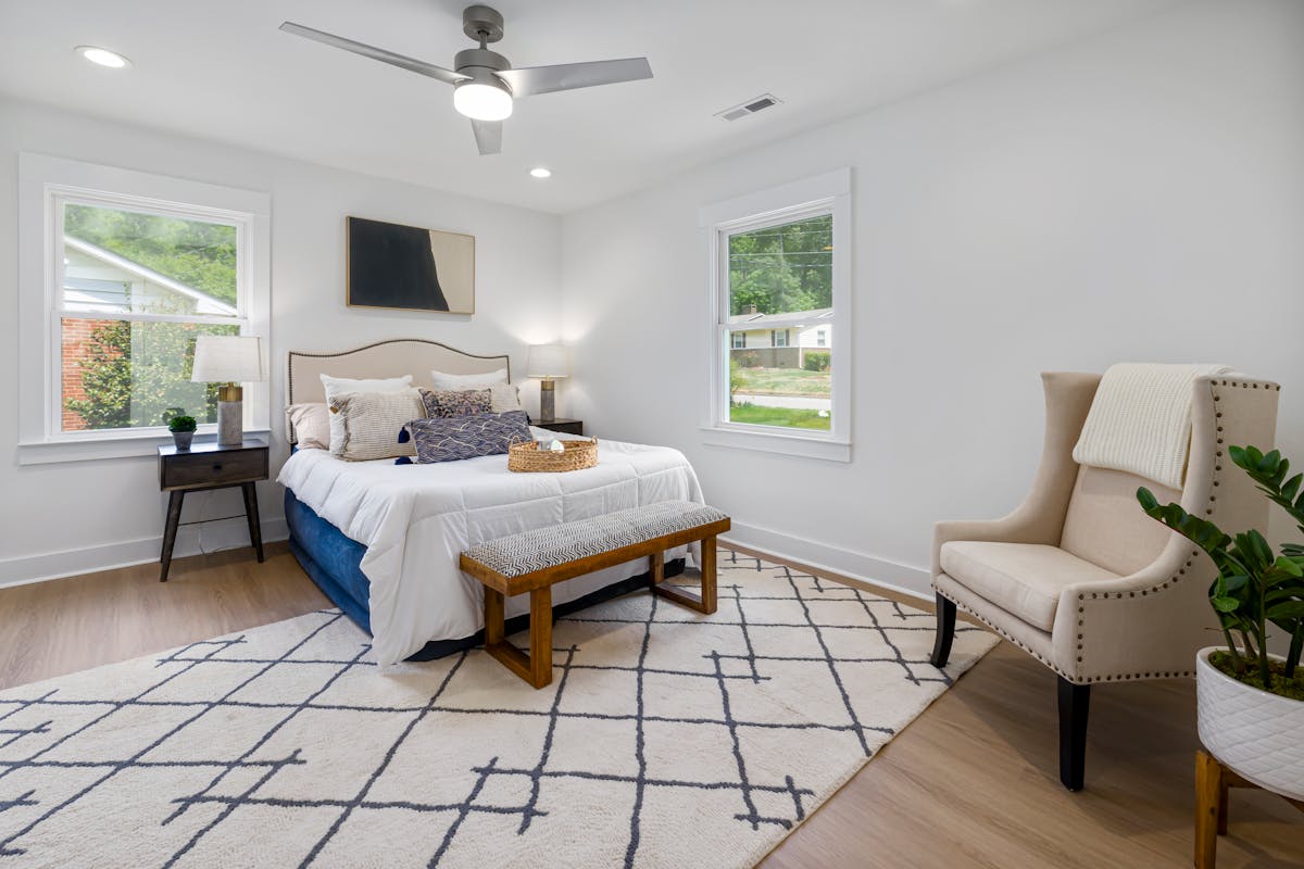 Contemporary bedroom with serene decor and natural light showing flexible bed placement, illustrating feng shui options