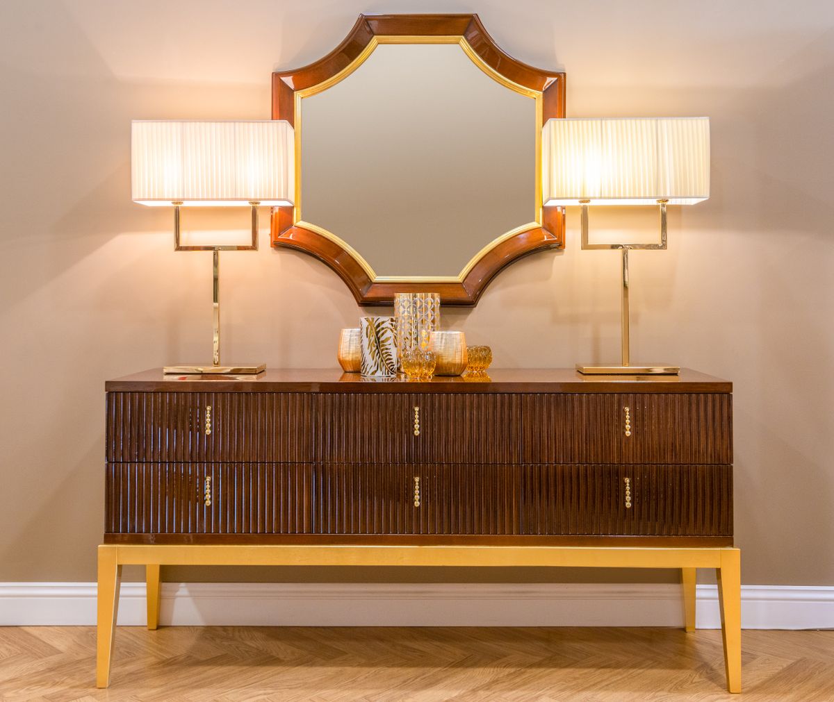 Mirrored console furniture illustrating reflective living room decor ideas Living room with a mirrored console cabinet and lamps, illustrating mirrored furniture as a decor idea