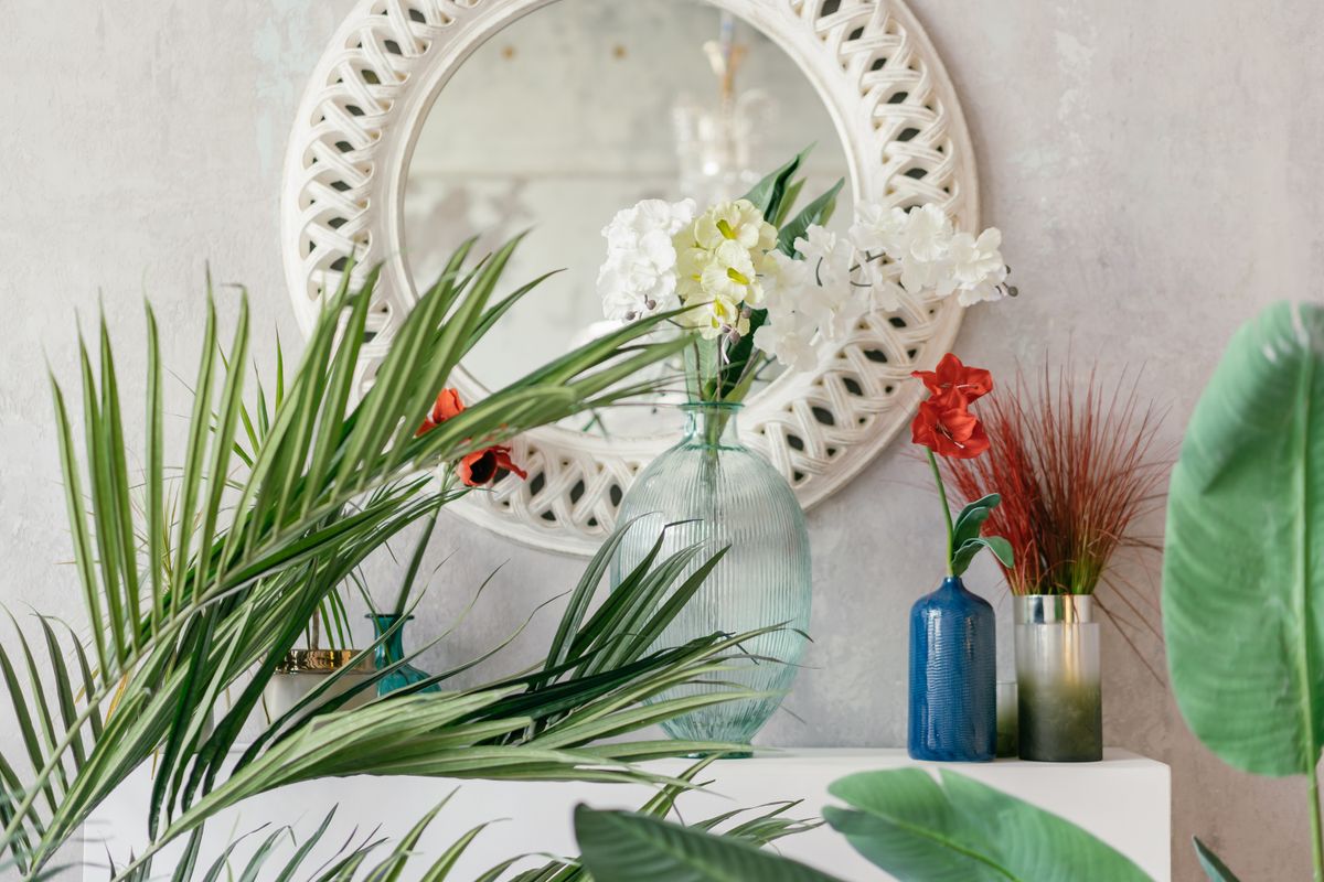 Elegant interior hallway with ornate wall mirror reflecting warm light symbolizing Feng Shui mirror placement and doubling reflection