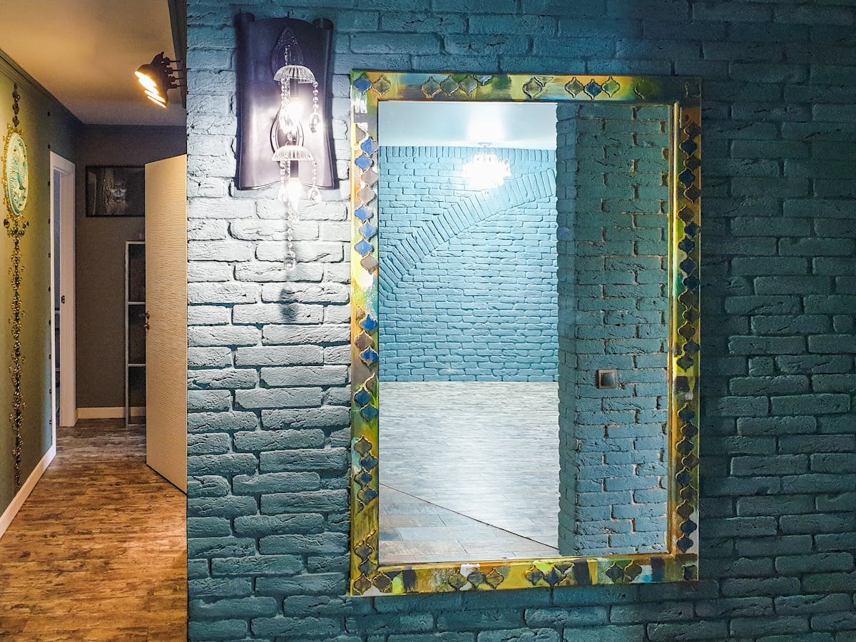 Chic living space with an artistic large mirror on a textured wall, illustrating a statement extra large mirror
